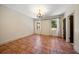 Empty bedroom shows tile flooring, natural lighting and a decorative chandelier at 843 17Th N Ave, St Petersburg, FL 33704