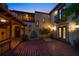 Picturesque courtyard with brick tile flooring, a small fountain, and views of balconies and the home's architecture at 843 17Th N Ave, St Petersburg, FL 33704