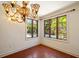 The dining room has terracotta tile flooring, a decorative chandelier, and a pool view at 843 17Th N Ave, St Petersburg, FL 33704