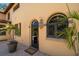 Arched entrance with lantern lighting, rounded window and potted plants at 843 17Th N Ave, St Petersburg, FL 33704