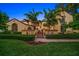 Stunning two-story home with lush landscaping, brick pathway and fountain at 843 17Th N Ave, St Petersburg, FL 33704