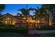 Beautiful home with manicured garden, Mediterranean architecture, and inviting brick pathway leading to gated entrance at 843 17Th N Ave, St Petersburg, FL 33704