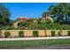 Charming exterior of a home featuring a secure wall, lush landscaping, and well-maintained lawn at 843 17Th N Ave, St Petersburg, FL 33704