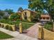 Beautiful exterior shot showcasing the home's curb appeal, manicured lawn, and brick driveway at 843 17Th N Ave, St Petersburg, FL 33704