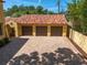 Spacious three-car garage with a brick-paved driveway and a barrel tile roof at 843 17Th N Ave, St Petersburg, FL 33704