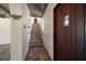 Hallway showcasing tile floor, staircase, and wood ceiling detail at 843 17Th N Ave, St Petersburg, FL 33704