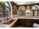 Gourmet kitchen with marble counters, custom cabinets, copper sink, and designer tile accents at 843 17Th N Ave, St Petersburg, FL 33704