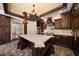 Gourmet kitchen boasts dark wood cabinets, an island, and stainless steel appliances at 843 17Th N Ave, St Petersburg, FL 33704