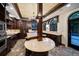 Gourmet kitchen features an island, arched windows, dark wood cabinetry, and custom lighting at 843 17Th N Ave, St Petersburg, FL 33704