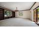 Spacious living area features built-in shelving, natural light, and a charming chandelier at 843 17Th N Ave, St Petersburg, FL 33704