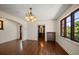 Living room featuring hardwood floors, chandelier lighting, and window at 843 17Th N Ave, St Petersburg, FL 33704