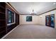 Large room with elegant chandelier, built-in bookshelves, and access to outdoor space through French doors at 843 17Th N Ave, St Petersburg, FL 33704