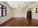 Living room featuring hardwood floors, large window, and chandelier lighting at 843 17Th N Ave, St Petersburg, FL 33704