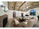 Spacious living room with vaulted wood ceiling, fireplace, and comfortable seating arrangement at 843 17Th N Ave, St Petersburg, FL 33704