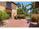 Charming outdoor patio with terracotta tiles, mature landscaping, and a small balcony at 843 17Th N Ave, St Petersburg, FL 33704