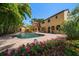 Backyard pool surrounded by lush landscaping that enhances the home's curb appeal at 843 17Th N Ave, St Petersburg, FL 33704