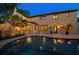 Backyard featuring a sparkling swimming pool surrounded by a paved patio and lush greenery, ideal for relaxation at 843 17Th N Ave, St Petersburg, FL 33704