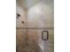 Modern shower with tan patterned tile, glass enclosure and shower niche at 843 17Th N Ave, St Petersburg, FL 33704