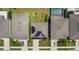 Aerial shot of houses with solar panels, manicured lawns, driveways, and neighborhood street at 8595 Prairie Creek Dr, New Port Richey, FL 34655