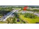 Drone view of homes in a community located near recreational areas, parks, and a water body at 8595 Prairie Creek Dr, New Port Richey, FL 34655