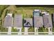 Overhead view featuring houses with solar panels, well-kept lawns, and screened-in pool area at 8595 Prairie Creek Dr, New Port Richey, FL 34655
