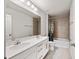 The bathroom features a double sink vanity and a shower-tub combination at 8595 Prairie Creek Dr, New Port Richey, FL 34655