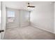 Bedroom features a window and modern ceiling fan at 8595 Prairie Creek Dr, New Port Richey, FL 34655