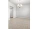 Dining area with neutral walls, tile flooring and a modern chandelier at 8595 Prairie Creek Dr, New Port Richey, FL 34655