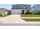 Charming two-story home with a well-manicured lawn and a two-car garage at 8595 Prairie Creek Dr, New Port Richey, FL 34655