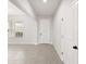 Clean, bright foyer with a white front door and tile flooring at 8595 Prairie Creek Dr, New Port Richey, FL 34655