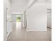 Bright foyer with tile flooring and an open floor plan to the living area at 8595 Prairie Creek Dr, New Port Richey, FL 34655
