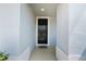 Welcoming entryway featuring a black front door and a 'HOME' welcome mat at 8595 Prairie Creek Dr, New Port Richey, FL 34655