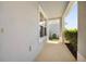 Covered porch with a window and views of the manicured front yard at 8595 Prairie Creek Dr, New Port Richey, FL 34655
