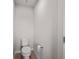 Neutral powder room features modern fixture and neutral finishes at 8595 Prairie Creek Dr, New Port Richey, FL 34655