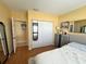 Comfortable bedroom with closet, stylish decor, and hardwood floors at 880 Mandalay Ave # N109, Clearwater Beach, FL 33767