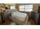 Comfortable bedroom with large window showcasing scenic beach views, enhanced by stylish furnishings at 880 Mandalay Ave # N109, Clearwater Beach, FL 33767