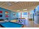 Spacious game room featuring a pool table, ping pong, foosball, and comfortable seating by the ocean at 880 Mandalay Ave # N109, Clearwater Beach, FL 33767