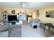 Cozy living area with updated decor, tile flooring, comfortable seating, and modern entertainment center at 880 Mandalay Ave # N109, Clearwater Beach, FL 33767