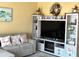 Comfortable living space with updated entertainment center and shelving, creating a cozy atmosphere at 880 Mandalay Ave # N109, Clearwater Beach, FL 33767