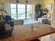 Cozy living room with sliding glass doors offering ocean views, filling the room with natural light at 880 Mandalay Ave # N109, Clearwater Beach, FL 33767