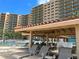 Lounge chairs surrounding the community pool at the condo building at 880 Mandalay Ave # N109, Clearwater Beach, FL 33767