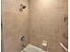 Close-up view of the tiled shower with updated fixtures at 880 Mandalay Ave # N109, Clearwater Beach, FL 33767