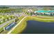A Primary-planned community with lush landscaping, scenic ponds, and resort-style amenities at 9287 Crescent Ray Dr, Wesley Chapel, FL 33545