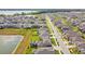 Aerial view of a beautiful neighborhood showcasing the lush landscaping, and community lakes at 9287 Crescent Ray Dr, Wesley Chapel, FL 33545