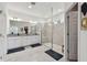 Spacious bathroom features a dual sink vanity, walk-in shower, and tile flooring at 9287 Crescent Ray Dr, Wesley Chapel, FL 33545