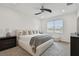 Well-lit main bedroom with neutral color palette and plush carpeting at 9287 Crescent Ray Dr, Wesley Chapel, FL 33545