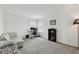 Bright bonus room features neutral walls, grey carpet, a modern workstation and a comfortable sitting area at 9287 Crescent Ray Dr, Wesley Chapel, FL 33545