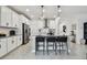 Clean kitchen with bright white cabinets, granite countertops, stainless appliances and ceramic tile flooring at 9287 Crescent Ray Dr, Wesley Chapel, FL 33545