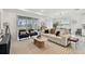 Open concept living room with bright neutral color scheme and view of dining area at 9287 Crescent Ray Dr, Wesley Chapel, FL 33545