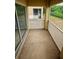 Cozy balcony area with a view of lush greenery, providing a tranquil outdoor space at 9516 Newdale Way # 101, Riverview, FL 33578